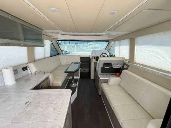 Great Expectations Yacht Photos Pics Luxurious interior of 2020 Regal 38 XO yacht with modern seating and helm.