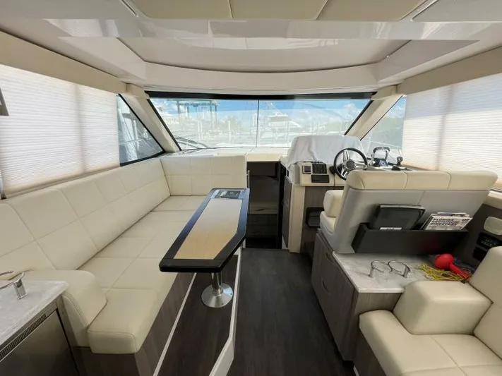 Great Expectations Yacht Photos Pics Luxurious interior of 2020 Regal 38 XO yacht with modern seating and helm.