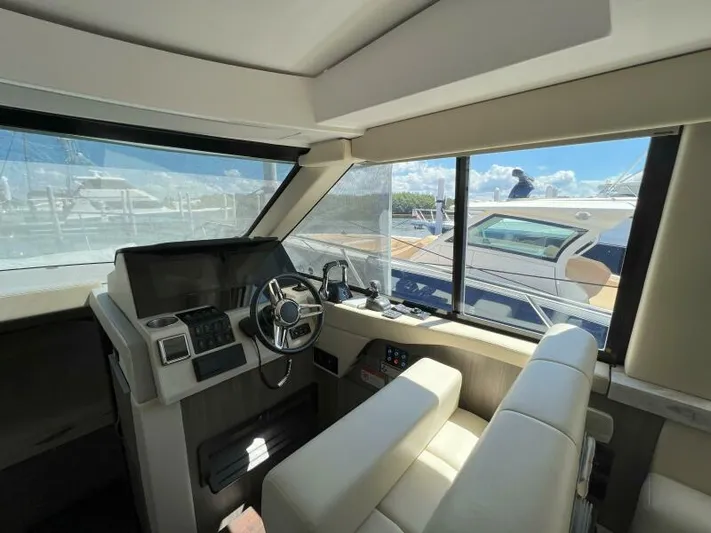 Great Expectations Yacht Photos Pics Interior of 2020 Regal 38 XO yacht with modern helm and seating.