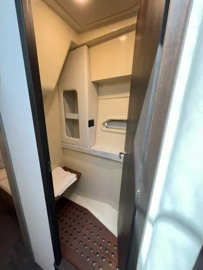 Great Expectations Yacht Photos Pics 2020 Regal 38 XO yacht interior bathroom with modern design and wooden accents.