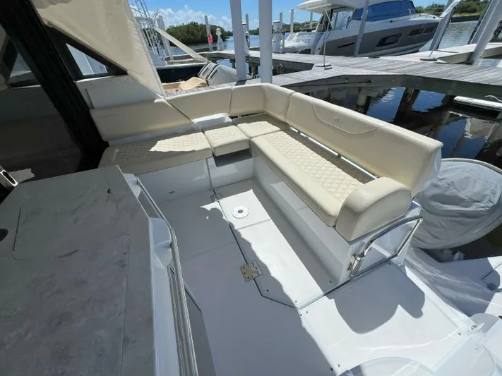 Great Expectations Yacht Photos Pics 2020 Regal 38 XO yacht with luxurious seating at marina dock.