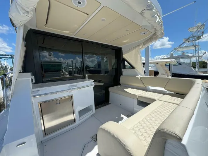 Great Expectations Yacht Photos Pics 2020 Regal 38 XO yacht interior with beige seating and kitchenette.