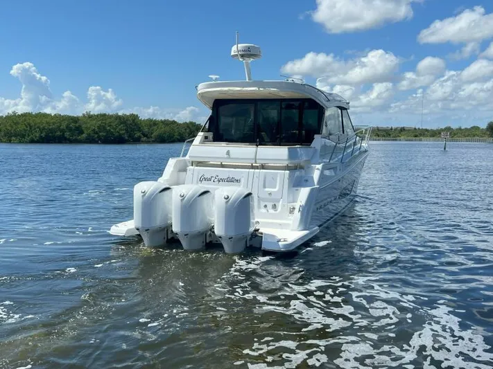 Great Expectations Yacht Photos Pics 2020 Regal 38 XO yacht on calm water under a blue sky.