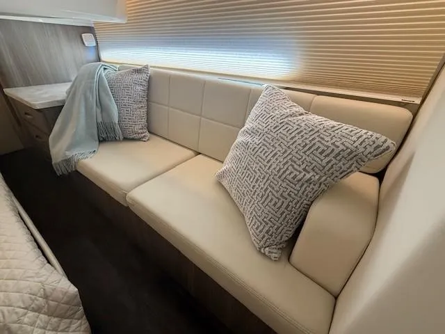 Great Expectations Yacht Photos Pics Luxurious interior of 2020 Regal 38 XO yacht with plush seating and decorative pillows.