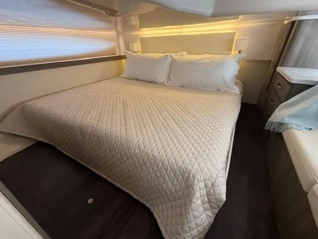 Great Expectations Yacht Photos Pics Luxurious bedroom interior of 2020 Regal 38 XO yacht with cozy bedding.