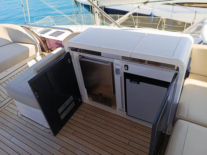 Waypoint Yacht Photos Pics 2024 Fairline Squadron 50 yacht deck with open storage and seating area.