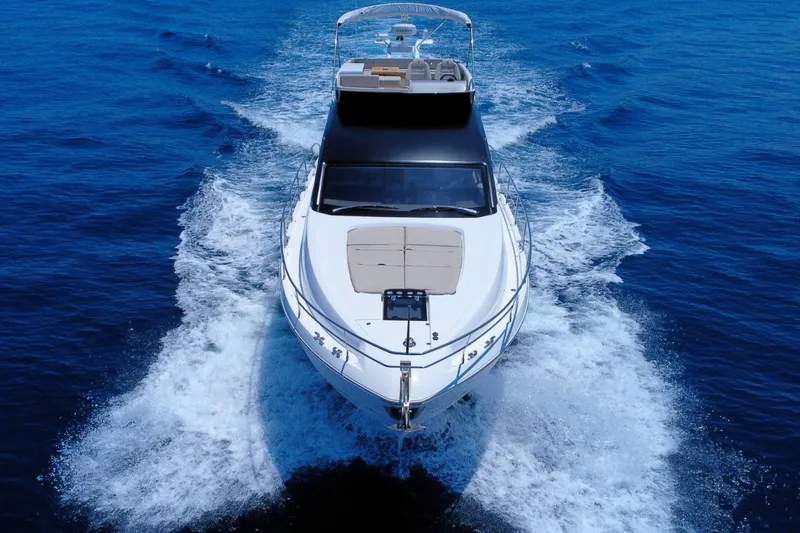 Waypoint Yacht Photos Pics 2024 Fairline Squadron 50 yacht cruising on open blue sea.