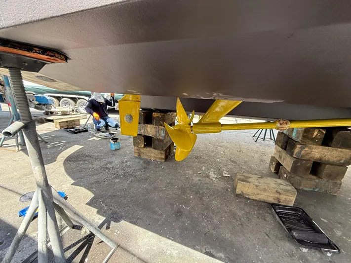  Yacht Photos Pics 2006 Sea Ray 52 Sedan Bridge undergoing maintenance, showing yellow propeller and hull support.