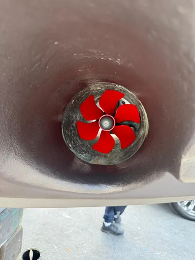  Yacht Photos Pics Red propeller inside a tunnel thruster of a 2006 Sea Ray 52 Sedan Bridge yacht.