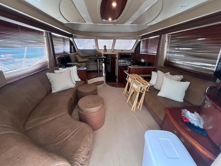  Yacht Photos Pics Luxurious interior of 2006 Sea Ray 52 Sedan Bridge yacht with plush seating and elegant design.