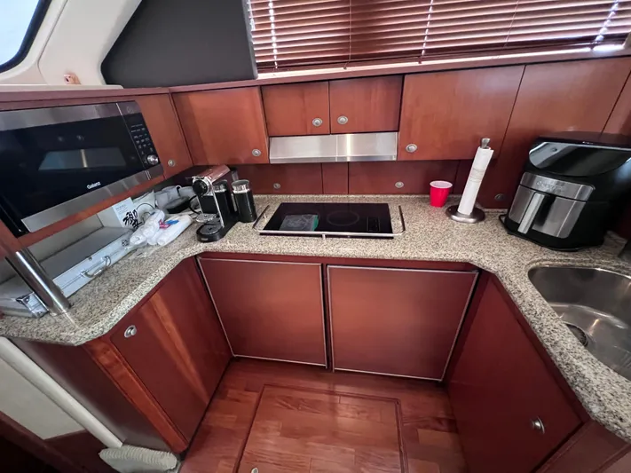  Yacht Photos Pics Luxurious kitchen in 2006 Sea Ray 52 Sedan Bridge yacht with modern appliances.