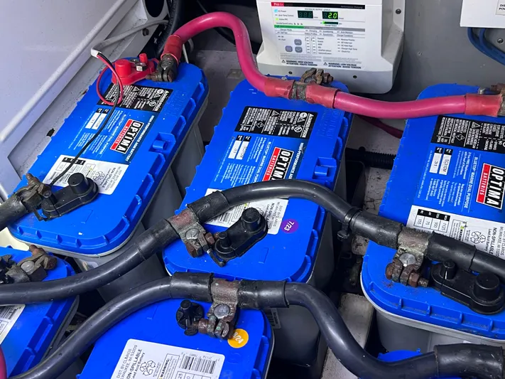  Yacht Photos Pics Batteries in a 2006 Sea Ray 52 Sedan Bridge engine room, featuring Optima blue top marine batteries.