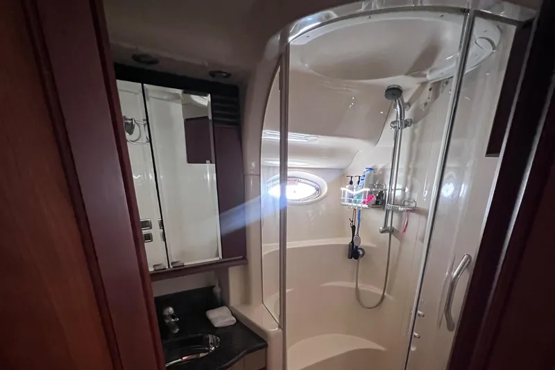 Yacht Photos Pics Luxurious bathroom in 2006 Sea Ray 52 Sedan Bridge yacht with shower and vanity.