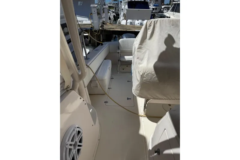 Chapuzon III Yacht Photos Pics 2001 Intrepid 377 Walkaround boat interior with seating and covered equipment.