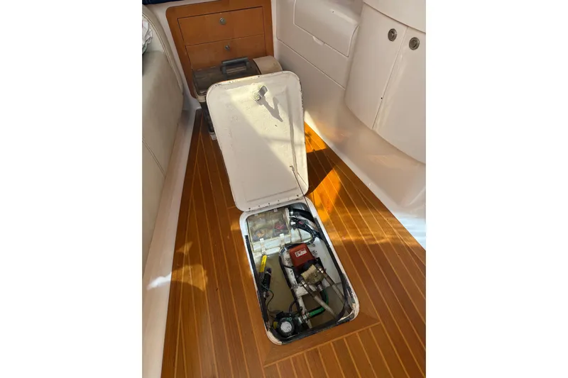 Chapuzon III Yacht Photos Pics 2001 Intrepid 377 Walkaround boat interior with open hatch revealing equipment.