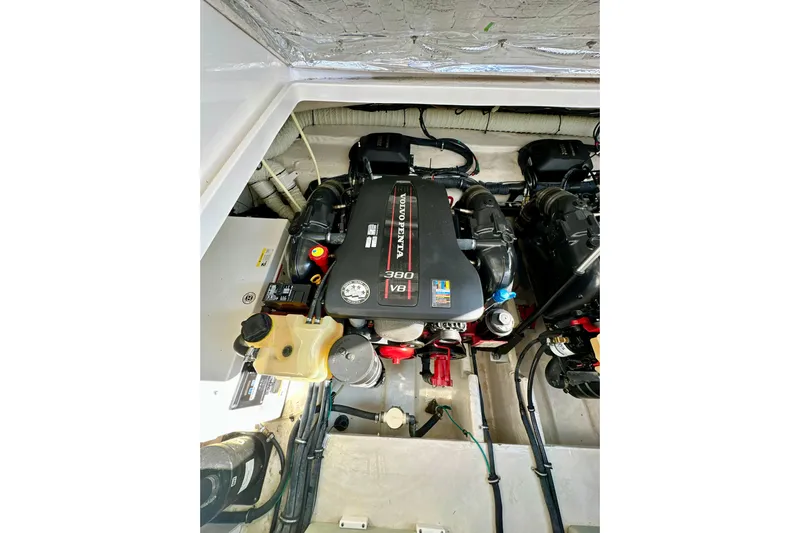 Carpe Diem Yacht Photos Pics Engine compartment of 2015 Rinker 340 Express Cruiser, featuring a Volvo Penta V8 engine.