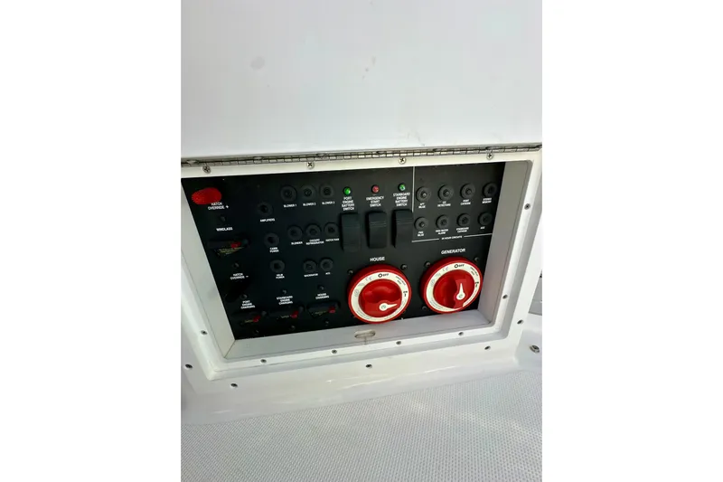 Carpe Diem Yacht Photos Pics Control panel of a 2015 Rinker 340 Express Cruiser boat with switches and dials.