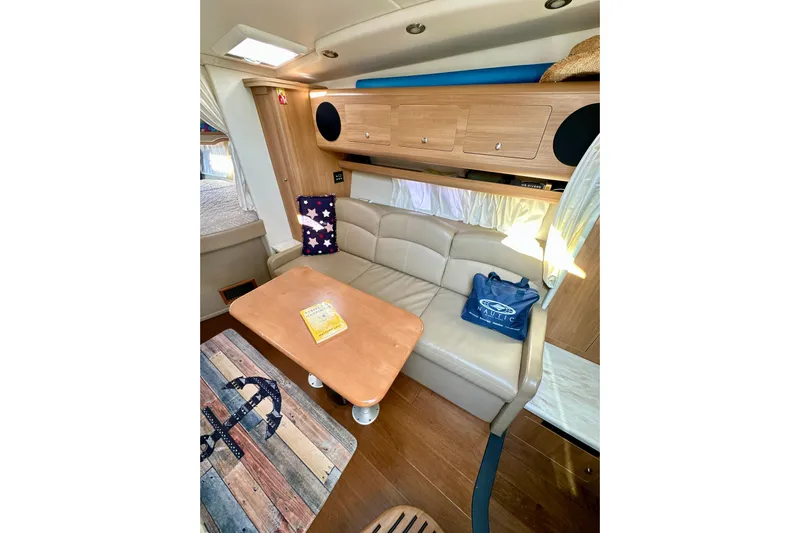 Carpe Diem Yacht Photos Pics Interior of 2015 Rinker 340 Express Cruiser with cozy seating and nautical decor.