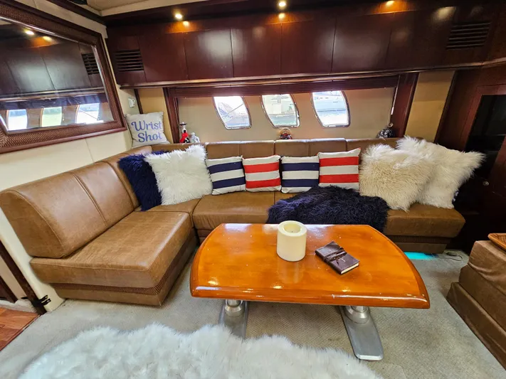 Wrist Shot Yacht Photos Pics Luxurious interior of 2005 Sea Ray 48 Sundancer with plush seating and elegant decor.