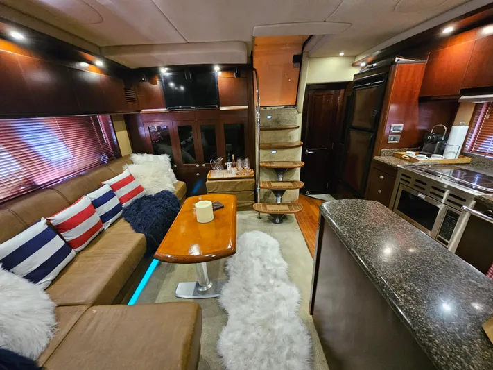 Wrist Shot Yacht Photos Pics Luxurious interior of 2005 Sea Ray 48 Sundancer yacht with plush seating and modern amenities.