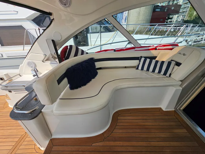 Wrist Shot Yacht Photos Pics Luxurious 2005 Sea Ray 48 Sundancer yacht interior with plush seating and stylish cushions.