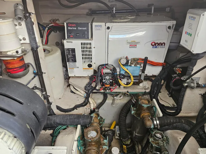 Wrist Shot Yacht Photos Pics Engine room of 2005 Sea Ray 48 Sundancer with Onan marine generator and wiring.