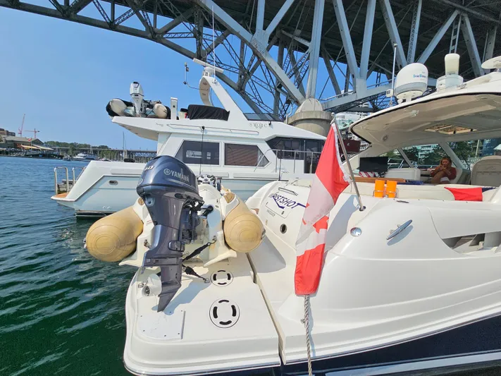 Wrist Shot Yacht Photos Pics 2005 Sea Ray 48 Sundancer yacht docked, featuring a Canadian flag and Yamaha outboard motor.