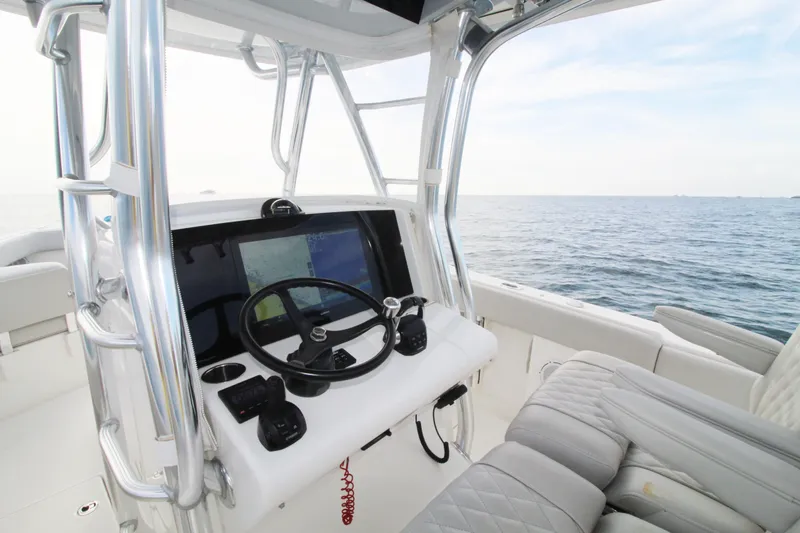  Yacht Photos Pics 2019 Jupiter 30 HFS boat helm with ocean view and modern controls.