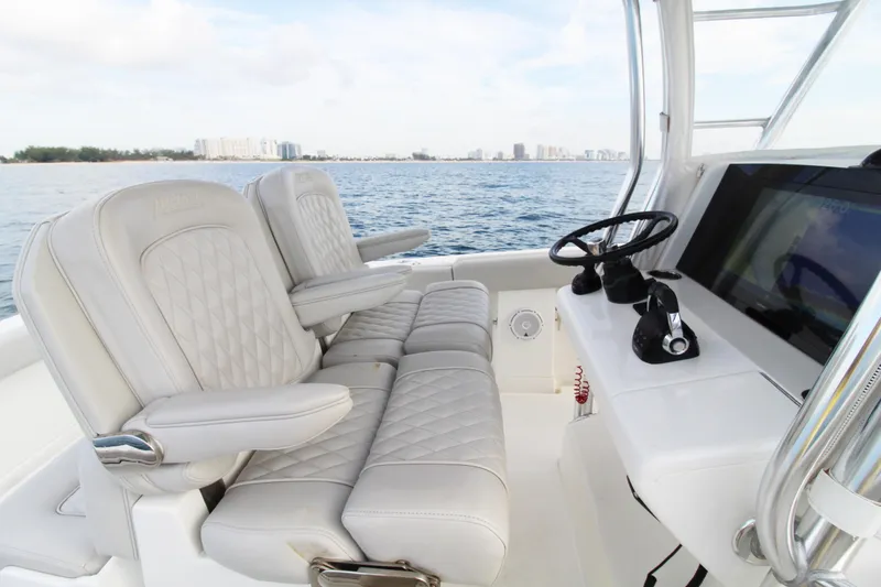  Yacht Photos Pics 2019 Jupiter 30 HFS boat interior with luxurious seating and modern helm controls.
