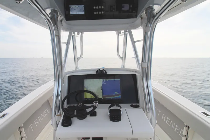  Yacht Photos Pics 2019 Jupiter 30 HFS boat helm with navigation display, steering wheel, and ocean view.