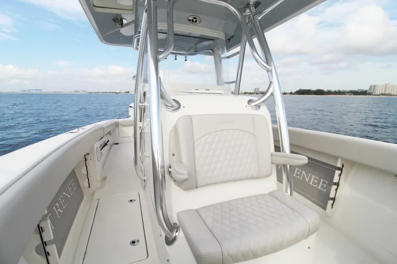  Yacht Photos Pics 2019 Jupiter 30 HFS boat interior with cushioned seating, ocean view, and clear sky.