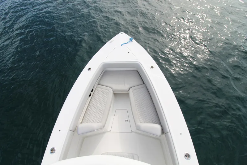  Yacht Photos Pics Top view of 2019 Jupiter 30 HFS boat bow with cushioned seating on water.