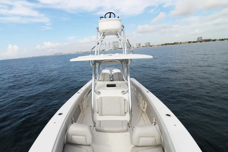  Yacht Photos Pics 2019 Jupiter 30 HFS boat on open water with city skyline in background.