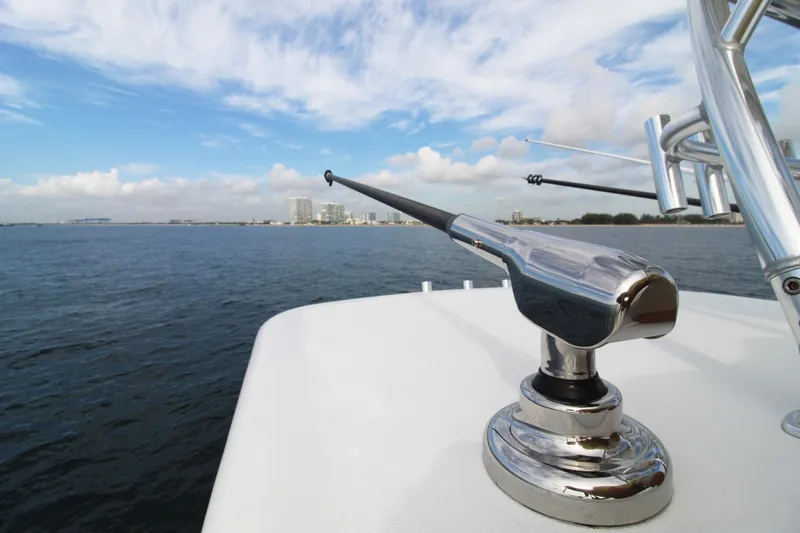  Yacht Photos Pics 2019 Jupiter 30 HFS boat with fishing rod holder on open water.