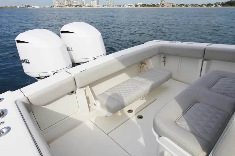  Yacht Photos Pics 2019 Jupiter 30 HFS boat interior with Yamaha engines, featuring cushioned seating and ocean view.