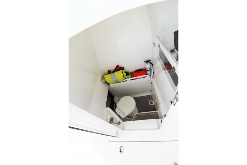  Yacht Photos Pics 2019 Jupiter 30 HFS boat interior with toilet and safety equipment.