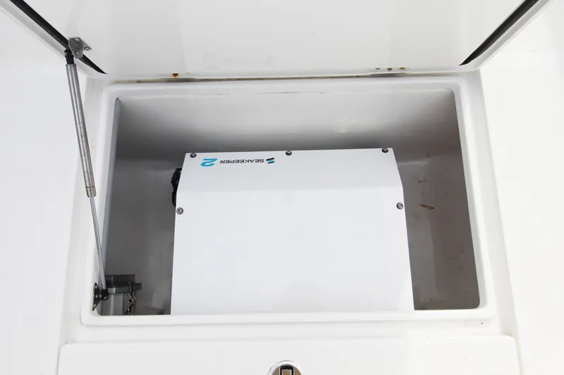  Yacht Photos Pics Storage compartment of a 2019 Jupiter 30 HFS boat with SeaKeeper equipment.