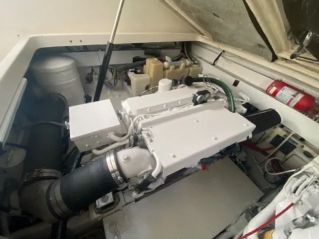 Vamonos Yacht Photos Pics Engine compartment of a 2001 Sea Ray 340 Amberjack boat, showcasing mechanical components.