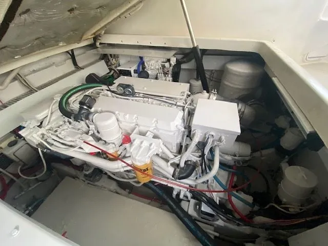 Vamonos Yacht Photos Pics Engine compartment of 2001 Sea Ray 340 Amberjack, showcasing detailed mechanical components.