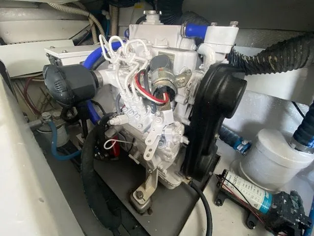 Vamonos Yacht Photos Pics Engine compartment of a 2001 Sea Ray 340 Amberjack boat, showcasing mechanical components.