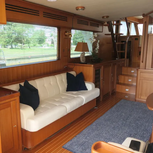  Yacht Photos Pics Luxurious interior of 2008 Marlow 53 C Explorer yacht with elegant wood finish.