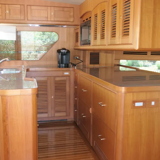  Yacht Photos Pics Luxurious wooden kitchen interior of 2008 Marlow 53 C Explorer yacht.