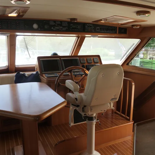  Yacht Photos Pics Interior of 2008 Marlow 53 C Explorer yacht with helm, steering wheel, and navigation equipment.