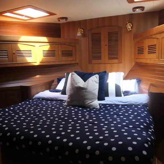  Yacht Photos Pics Luxurious cabin interior of 2008 Marlow 53 C Explorer yacht with cozy bedding.