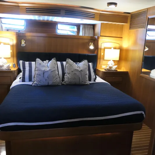  Yacht Photos Pics Luxurious bedroom interior of 2008 Marlow 53 C Explorer yacht with elegant bedding.