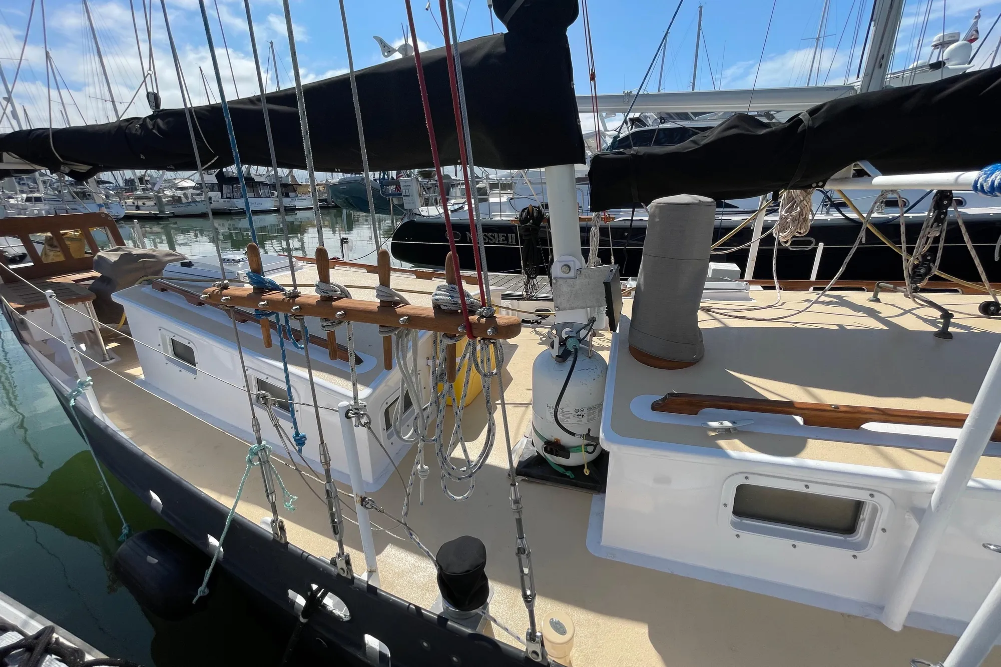 Sailboat docked at marina, Pinky Custom model, 2008, with visible rigging and deck details.