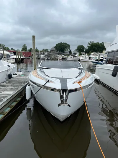  Yacht Photos Pics 2022 Fairline F//Line 33 yacht docked in a marina, overcast sky.