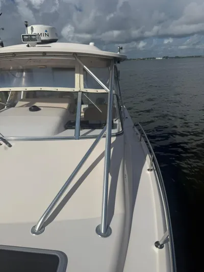  Yacht Photos Pics 2007 Grady-White Express 330 boat on calm water under cloudy sky.