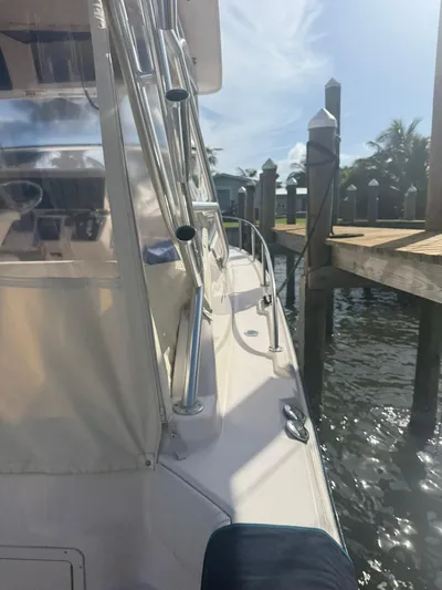  Yacht Photos Pics 2007 Grady-White Express 330 boat docked, featuring sleek design and sunny waterfront setting.