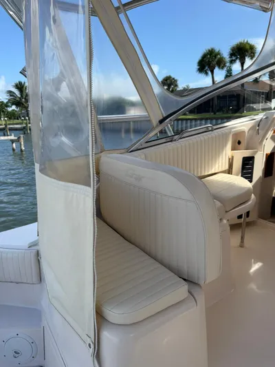  Yacht Photos Pics 2007 Grady-White Express 330 boat interior with white seating and clear canopy.